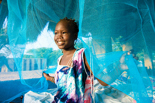 Girl with malaria net